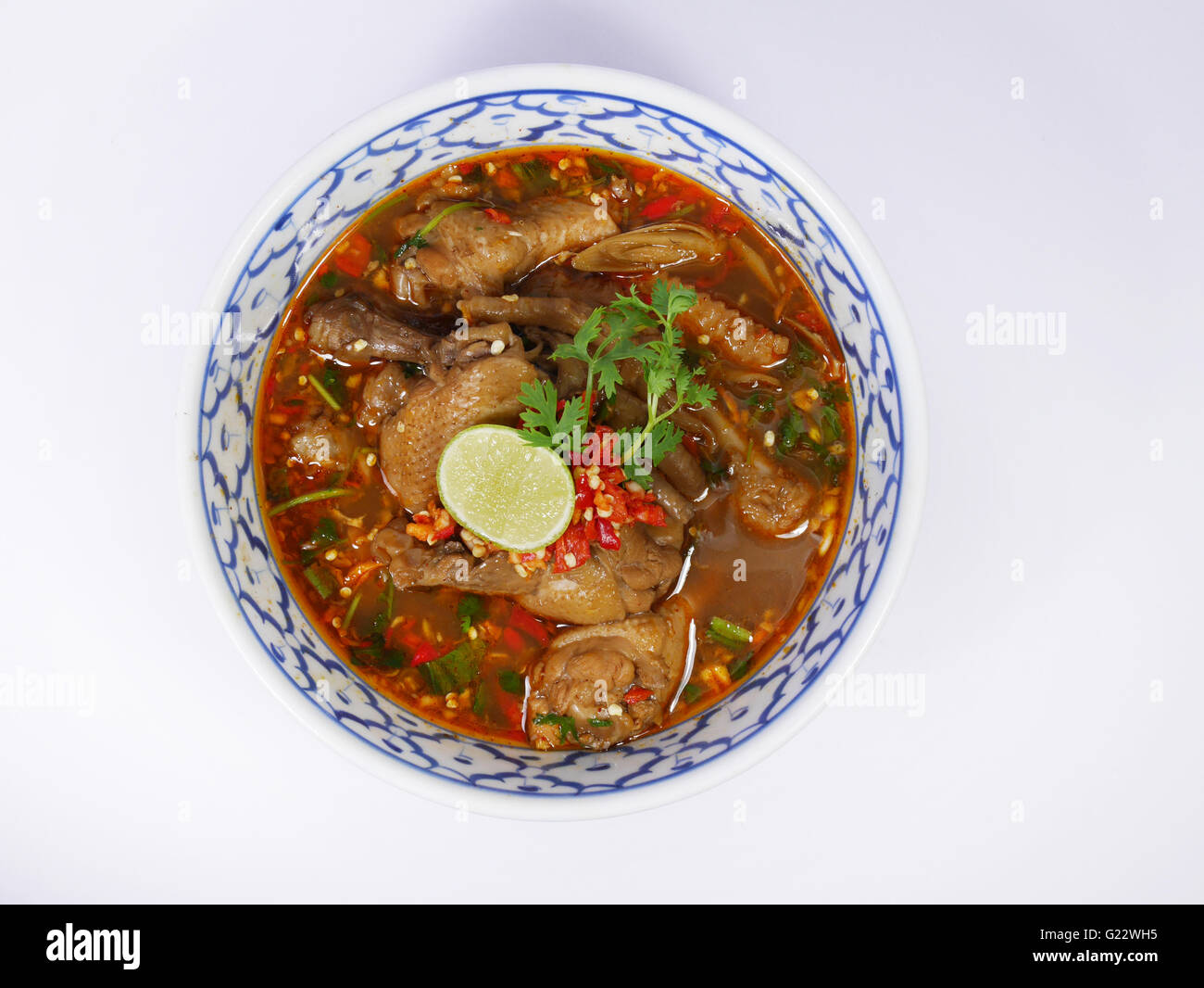 Thai style spicy chicken legs and wings soup Stock Photo
