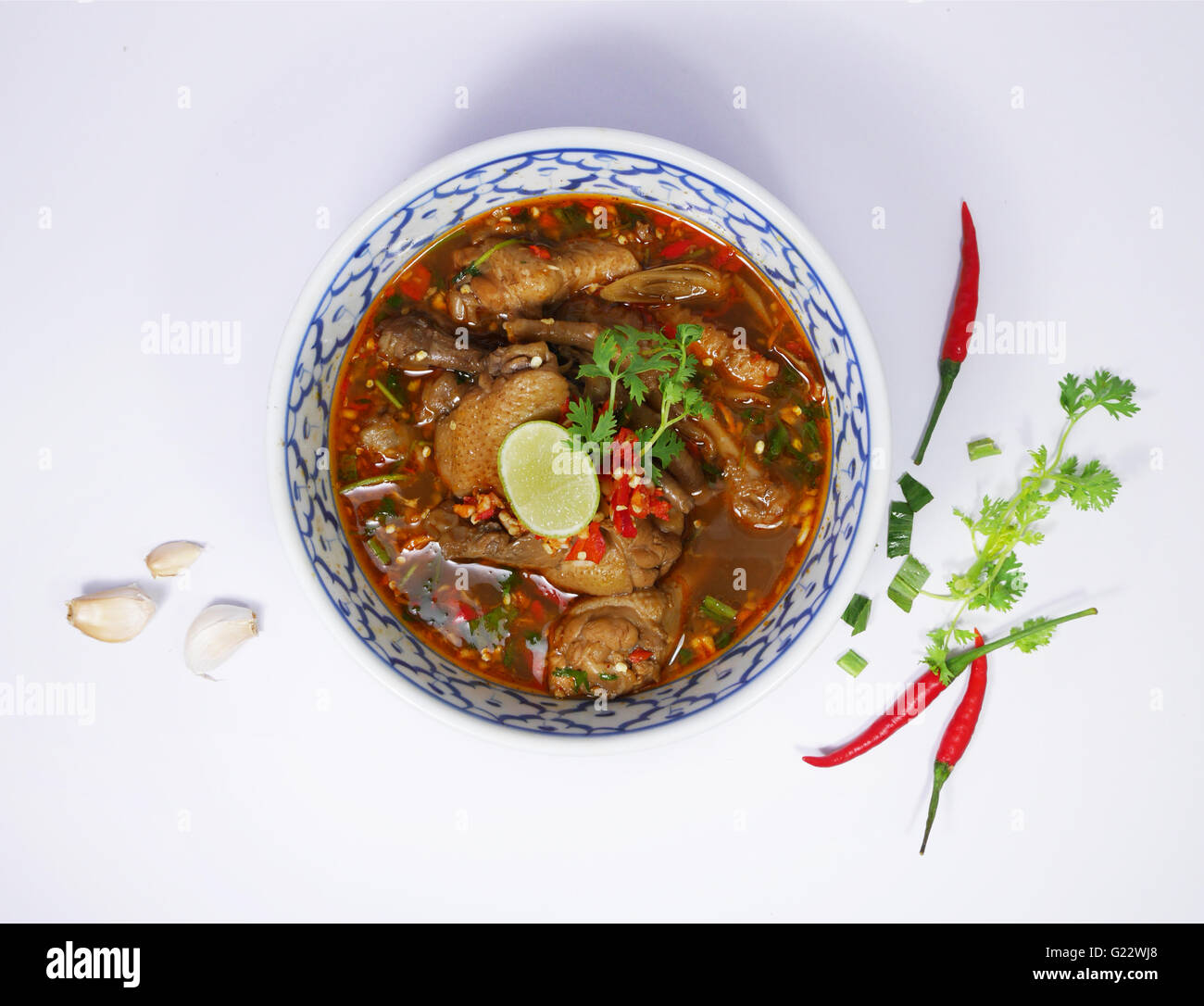 Thai style spicy chicken legs and wings soup Stock Photo