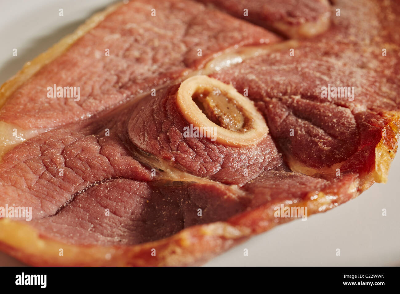 Whole, cooked country ham steak from Broadbent Hams in Kentucky, USA