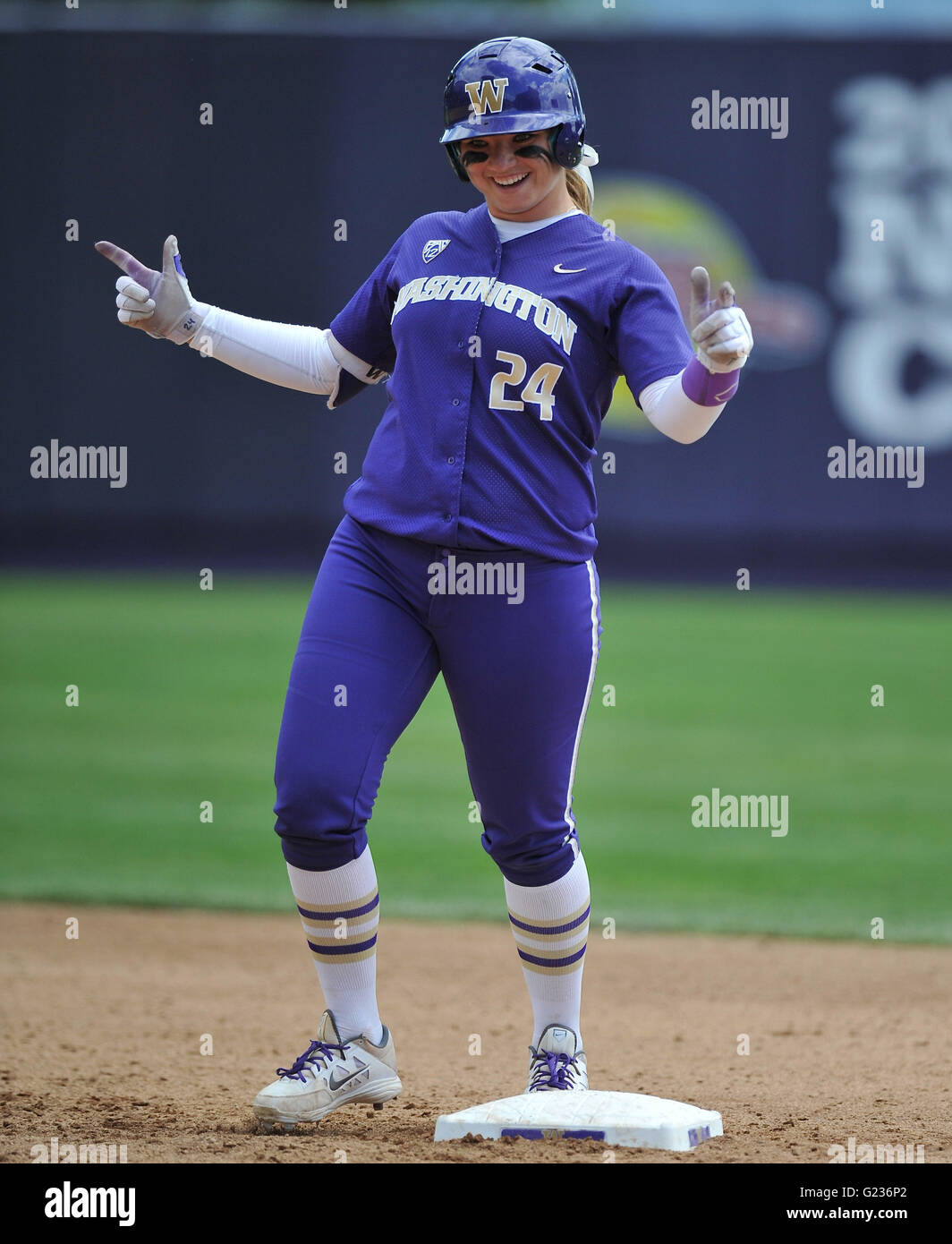 Washington's Casey Stangel (24) acknowledges the UW bench from 2nd base after hitting a base clearing, 3 run double vs Minnesota. Stangel went 2 for 3 and had 4 rbi's during the game. UW won the NCAA Regional final game 15-7 against Minnesota in Seattle. Jeff Halstead/CS Media © Jeff Halstead/Cal Sport Media Stock Photo