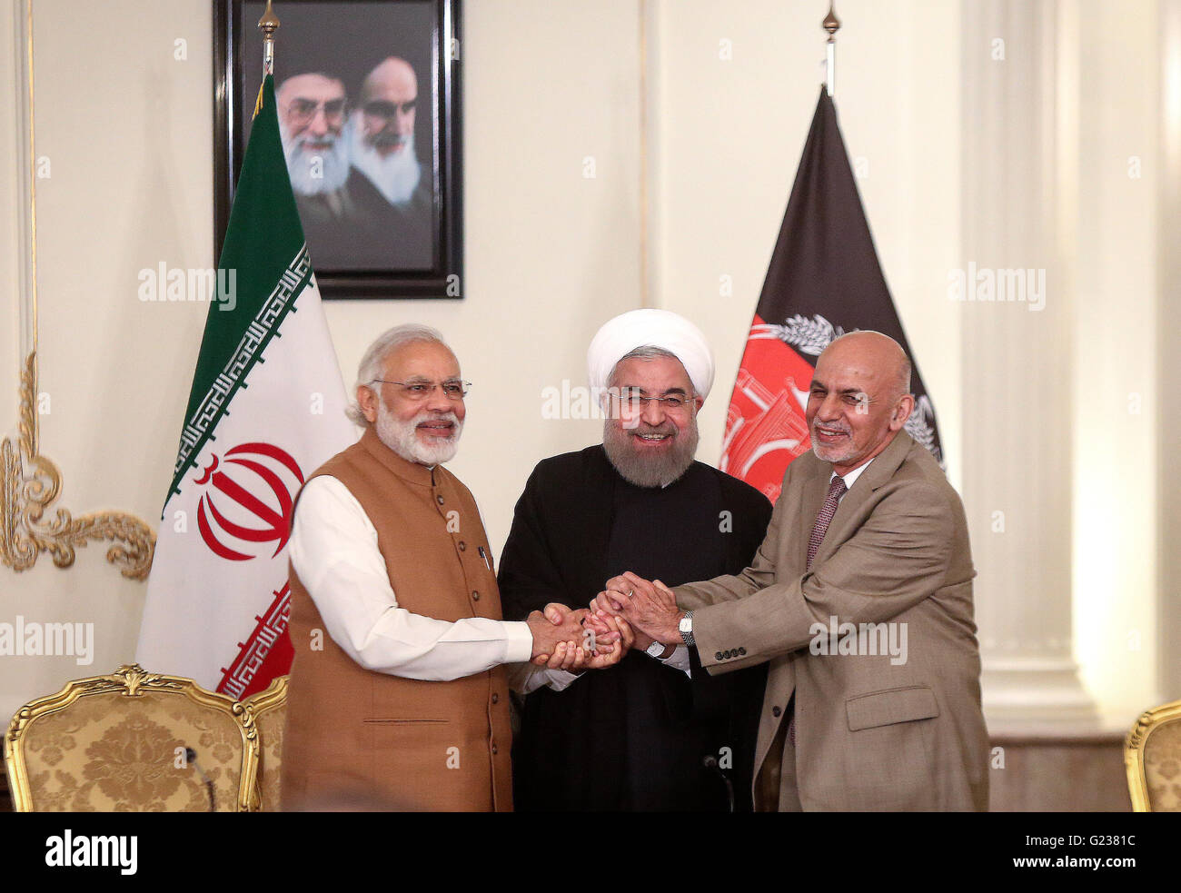 (160524) -- TEHRAN, May 24, 2016 (Xinhua) -- (From L to R) Indian Prime Minister Narendra Modi, Iranian President Hassan Rouhani and Afghan President Ashraf Ghani shake hands after their meeting at Saadabad Palace in Tehran, Iran, on May 23, 2016. Iran, India and Afghanistan signed a trilateral deal here on Monday to boost their regional trade and economic cooperation. The agreement, signed in the presence of Iranian President Hassan Rouhani, Indian Prime Minister Narendra Modi and Afghan President Ashraf Ghani, is to develop Iran's Chabahar port, which would serve as a transit route connectin Stock Photo