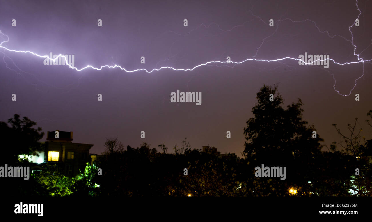 New Delhi, India. 23rd May, 2016. Lightenings are seen in the sky of New Delhi, India, May 23, 2016. Moderate rainfall came to the capital city of India on Monday, giving residents a respite from the rising temperature. Credit:  Bi Xiaoyang/Xinhua/Alamy Live News Stock Photo