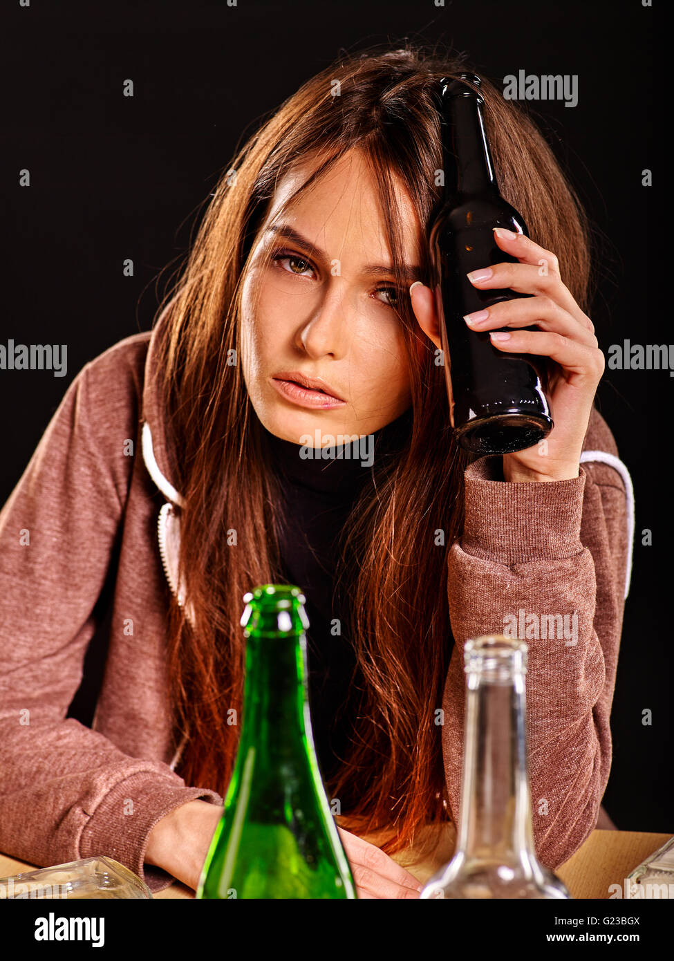 Drunk girl holding bottle of vodka Stock Photo Alamy