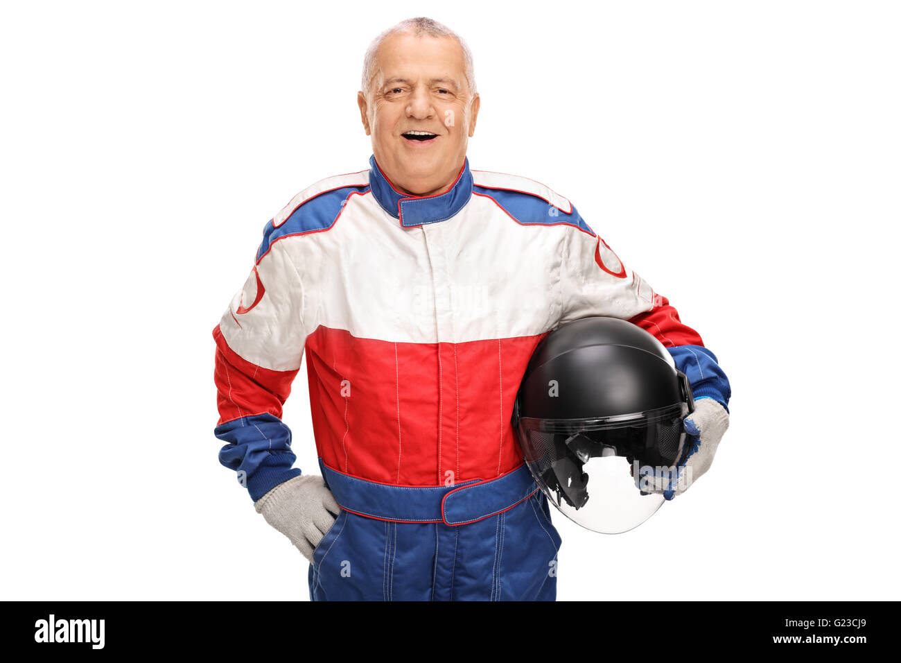 Cheerful mature car racer holding a helmet and smiling isolated on white background Stock Photo