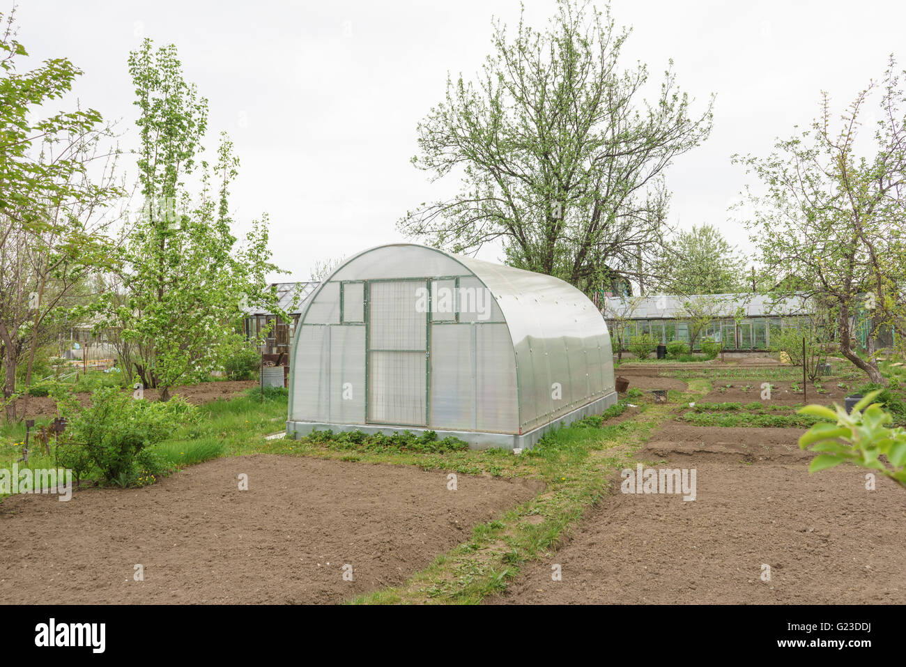 A small greenhouse with air vents in the garden Stock Photo Alamy