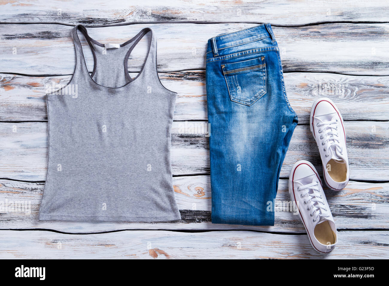 Gray tank top and jeans Stock Photo - Alamy