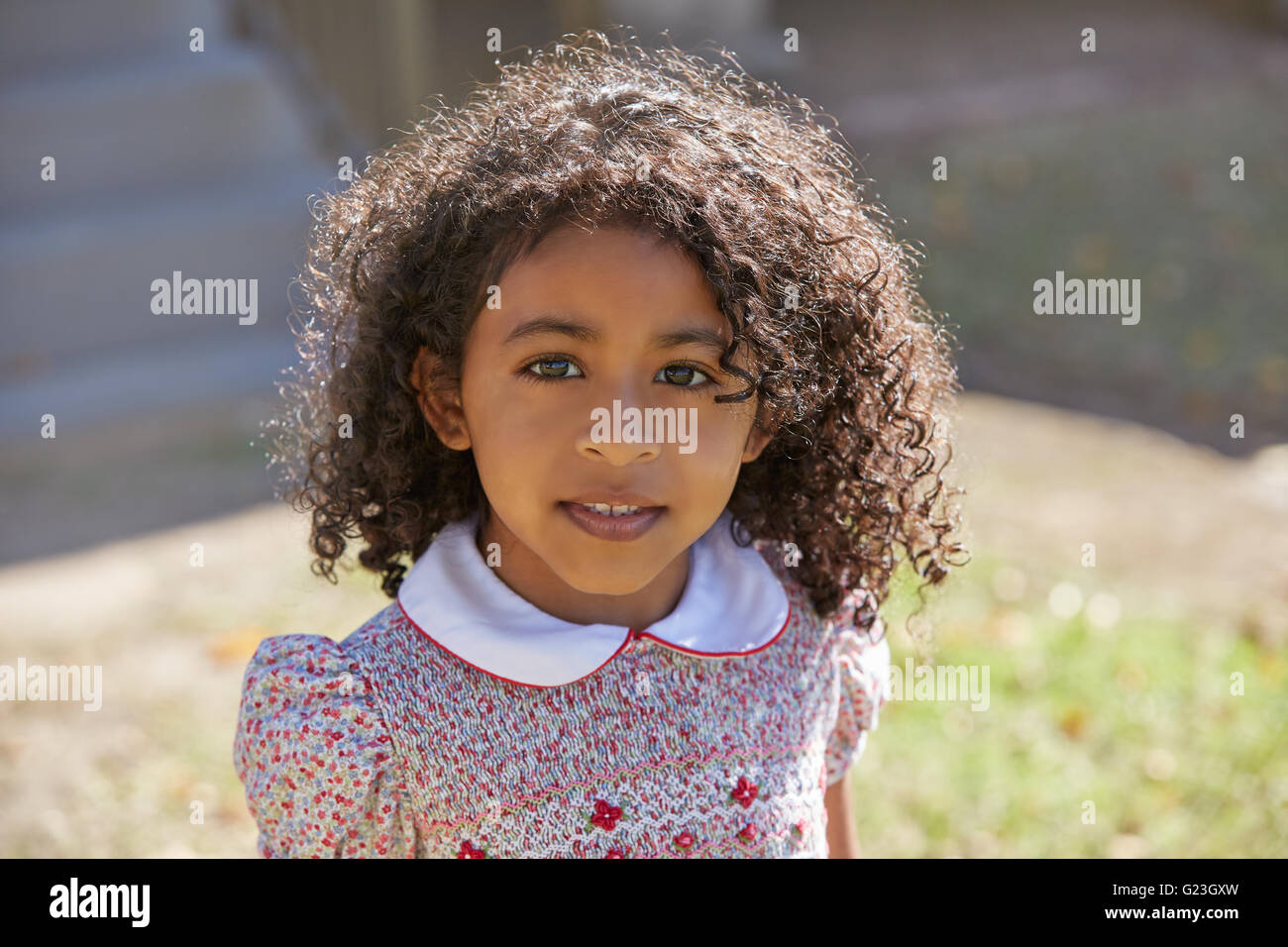 Toddler kid girl portrait latin ethnicity with flowers dress Stock Photo