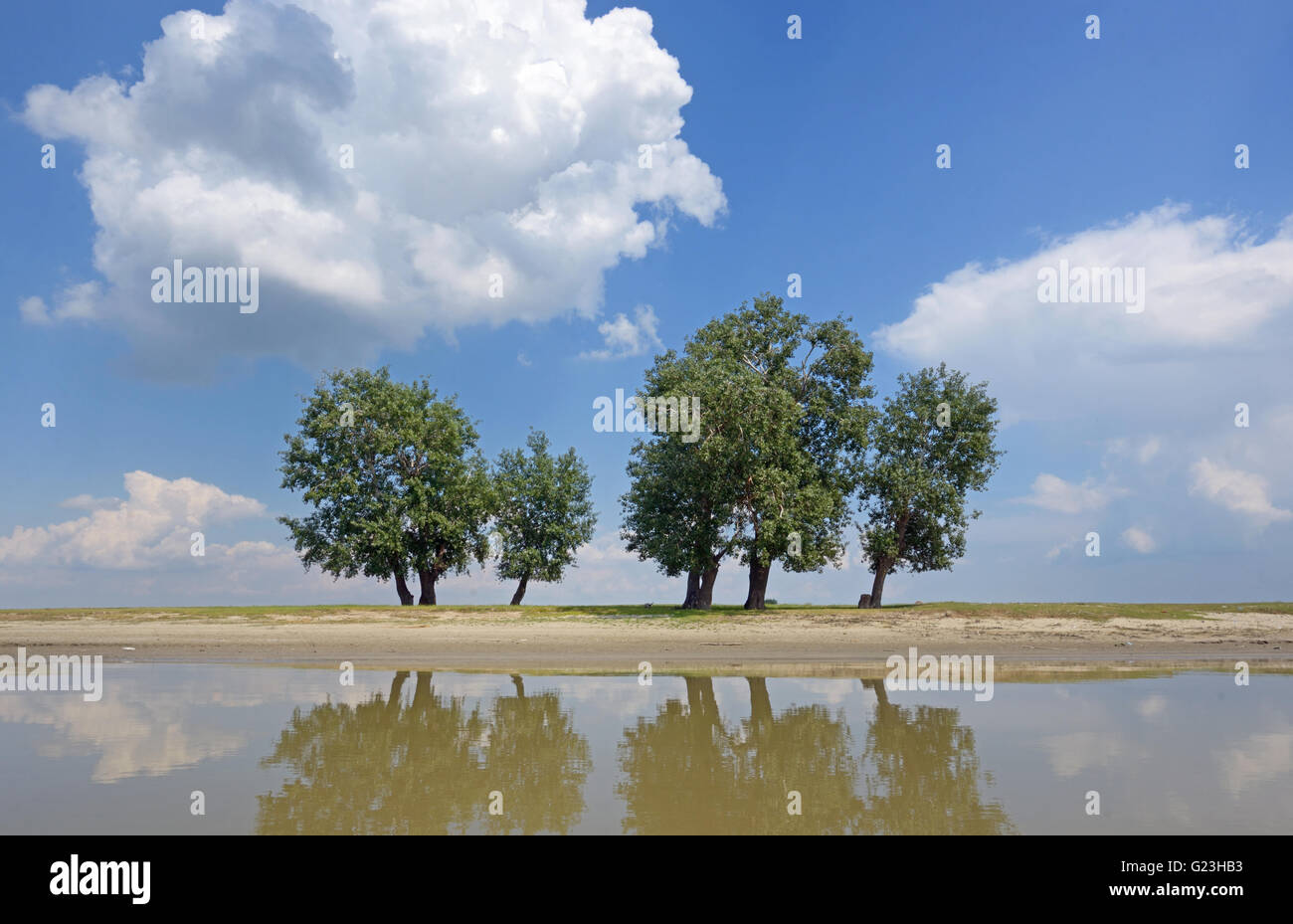 Reflexion of clouds and trees in the Danube river Stock Photo