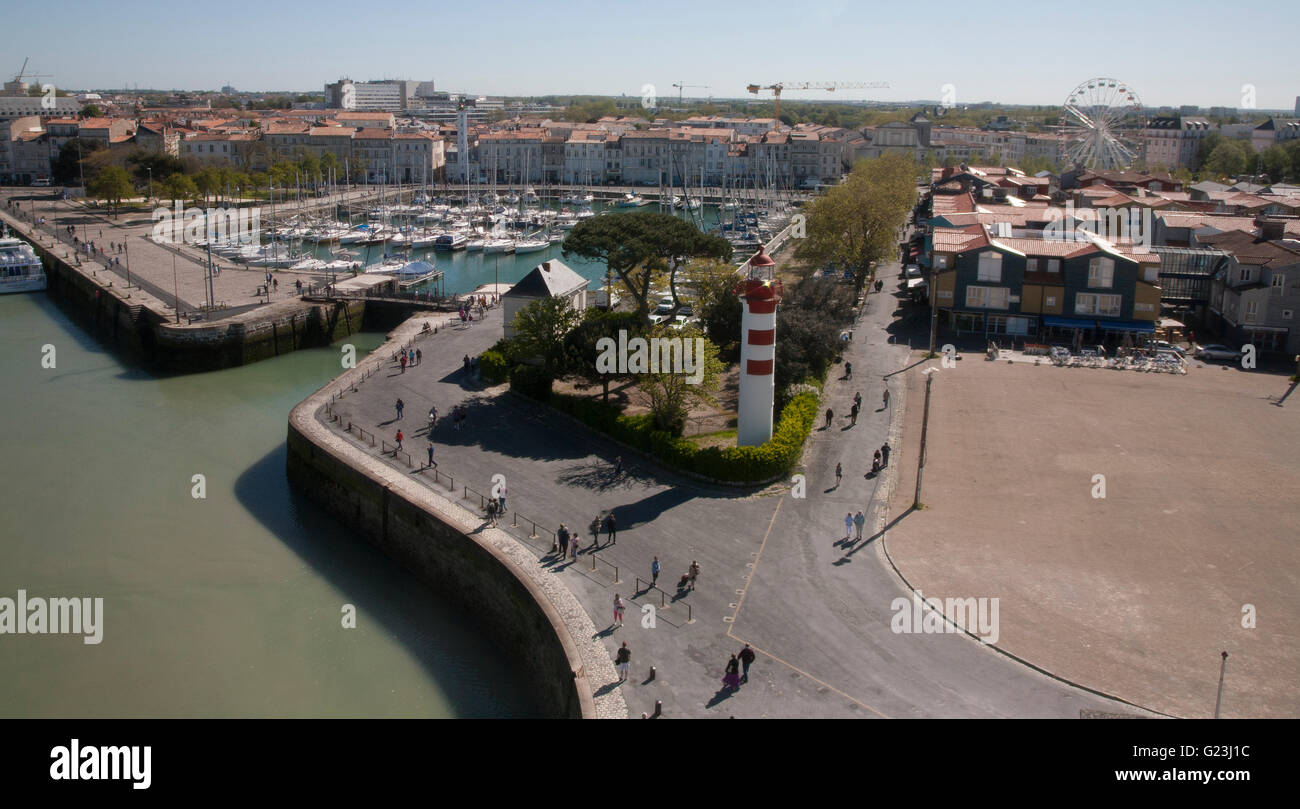 France, la Rochelle, promenade towards St Nicolas Tower with lighthouse, marina, restarants & cafes. Stock Photo