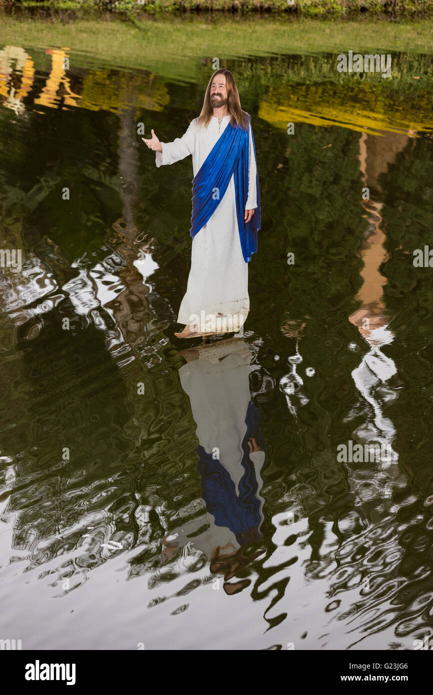 A cardboard cutout of Jesus Christ walking on water at the Holy Land Experience Christian theme park in Orlando, Florida. Stock Photo