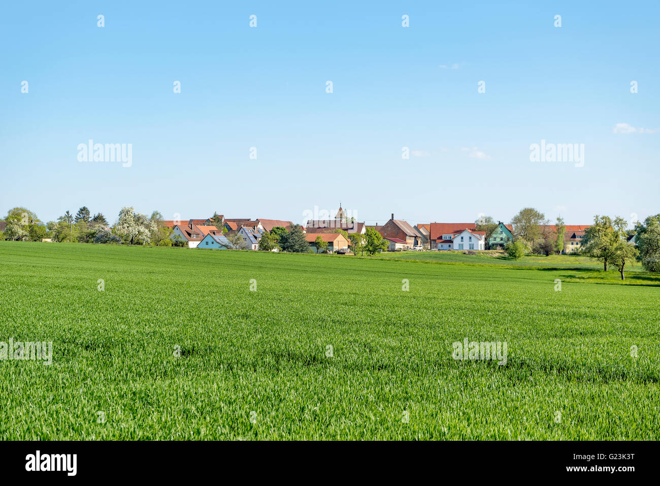 sunny illuminated idyllic rural springtime scenery around a small village  in Hohenlohe, a district in Southern Germany Stock Photo