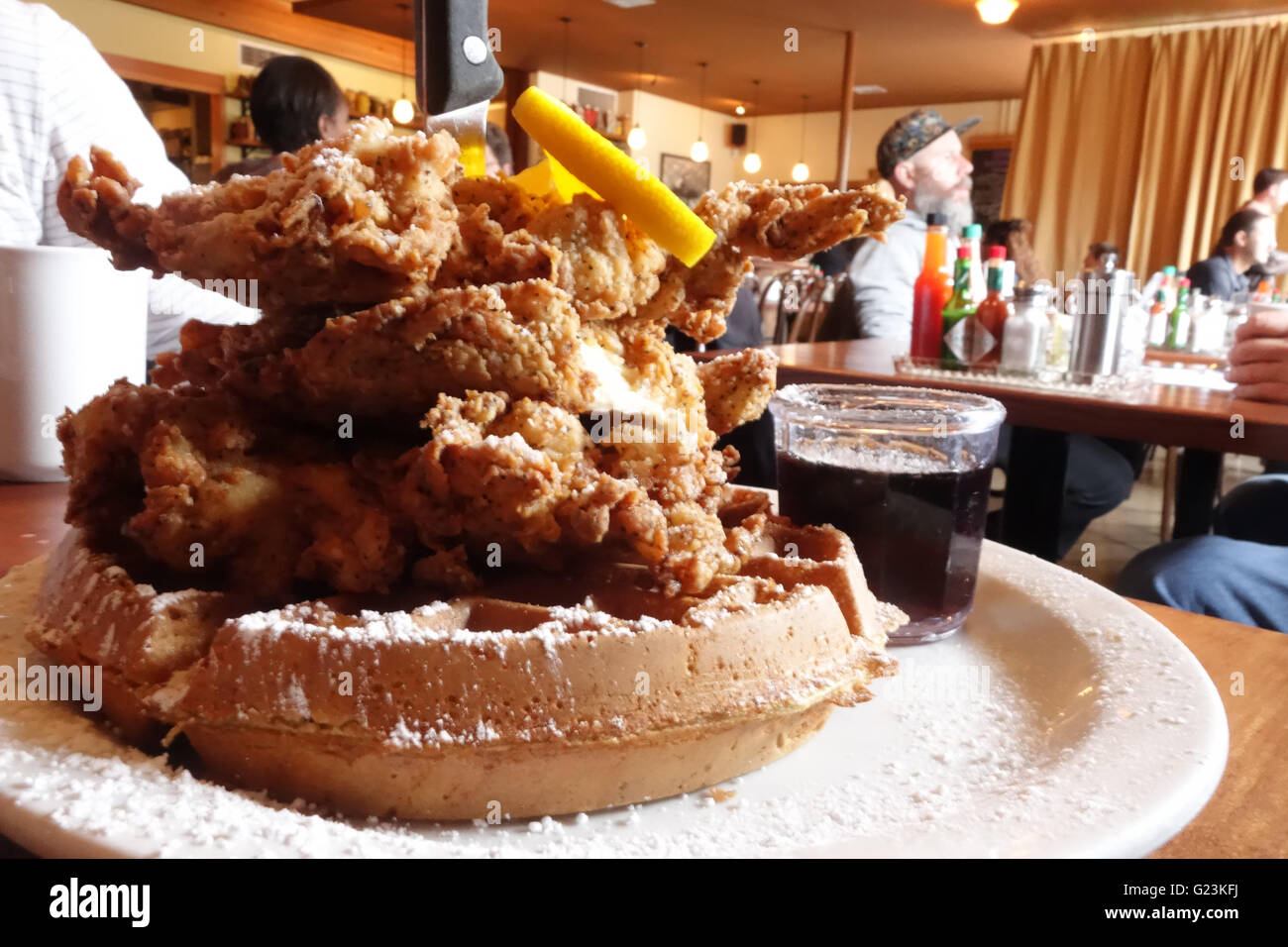 fried chicken waffles inside restaurant Stock Photo Alamy
