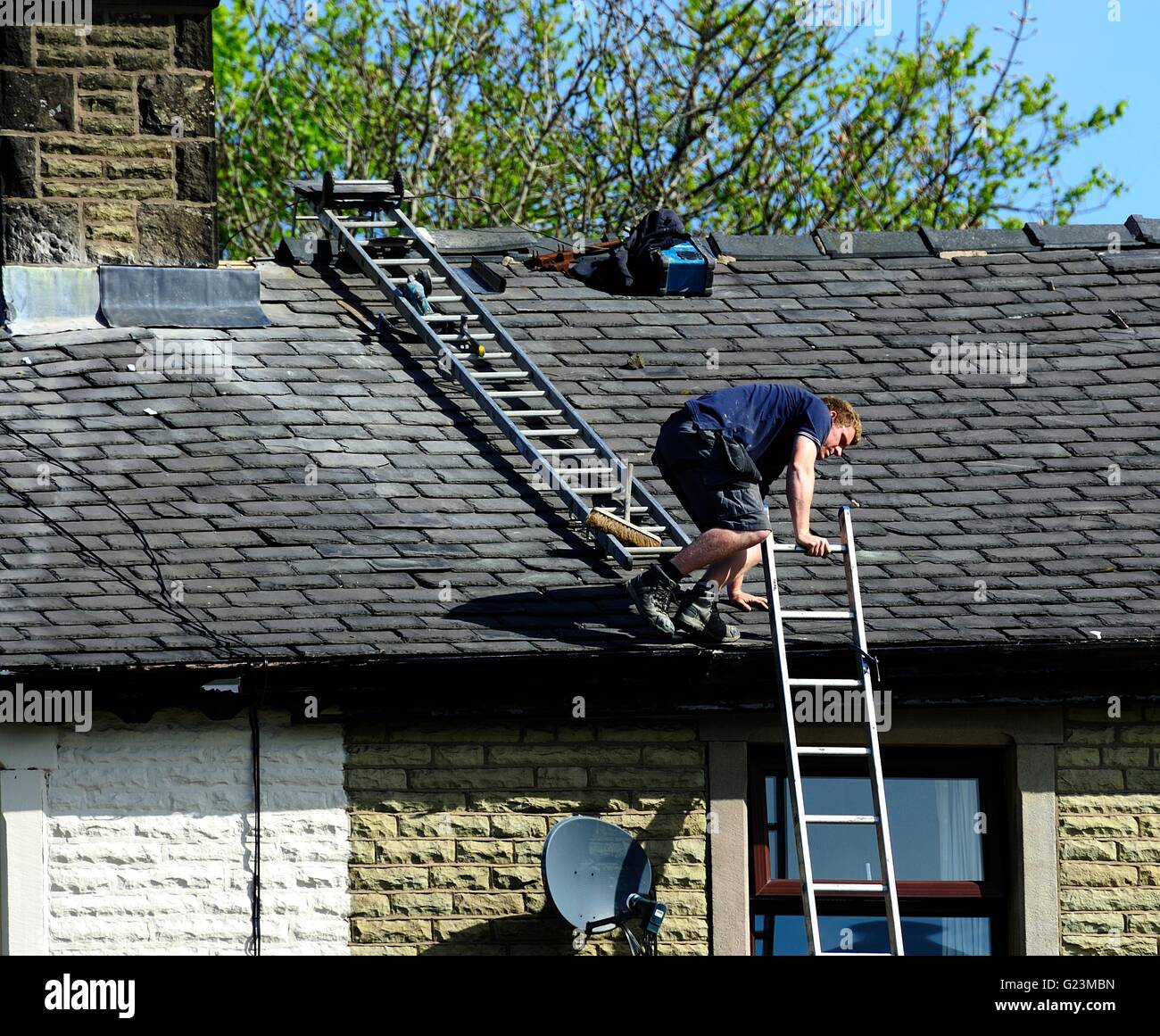 Lead flashing workers on a slate roof Stock Photo Alamy
