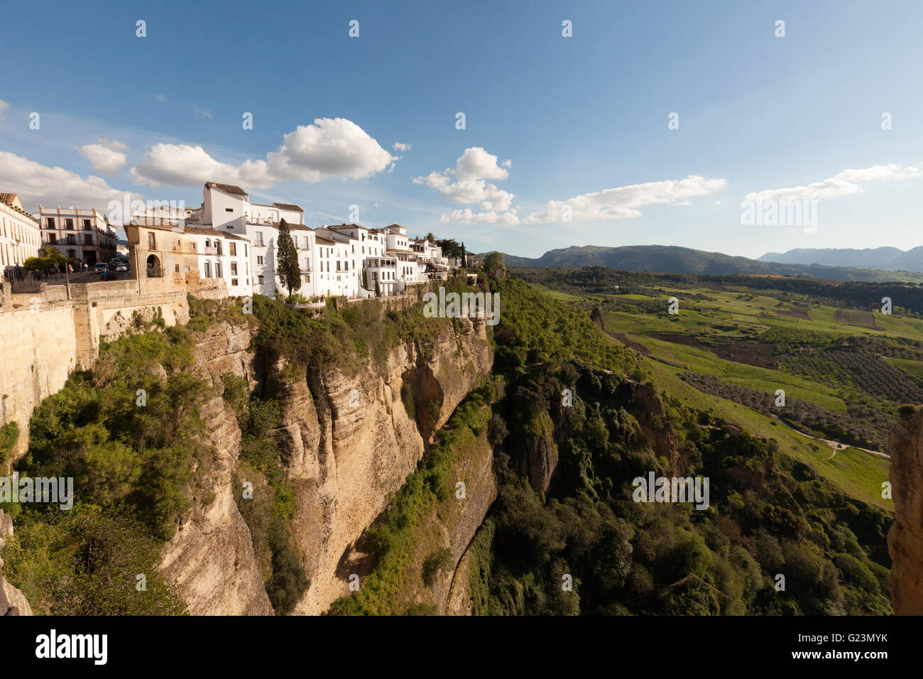 White houses perched on the edge of a cliff, in Ronda, an example of a Spanish White Town, Andalusia Spain Stock Photo