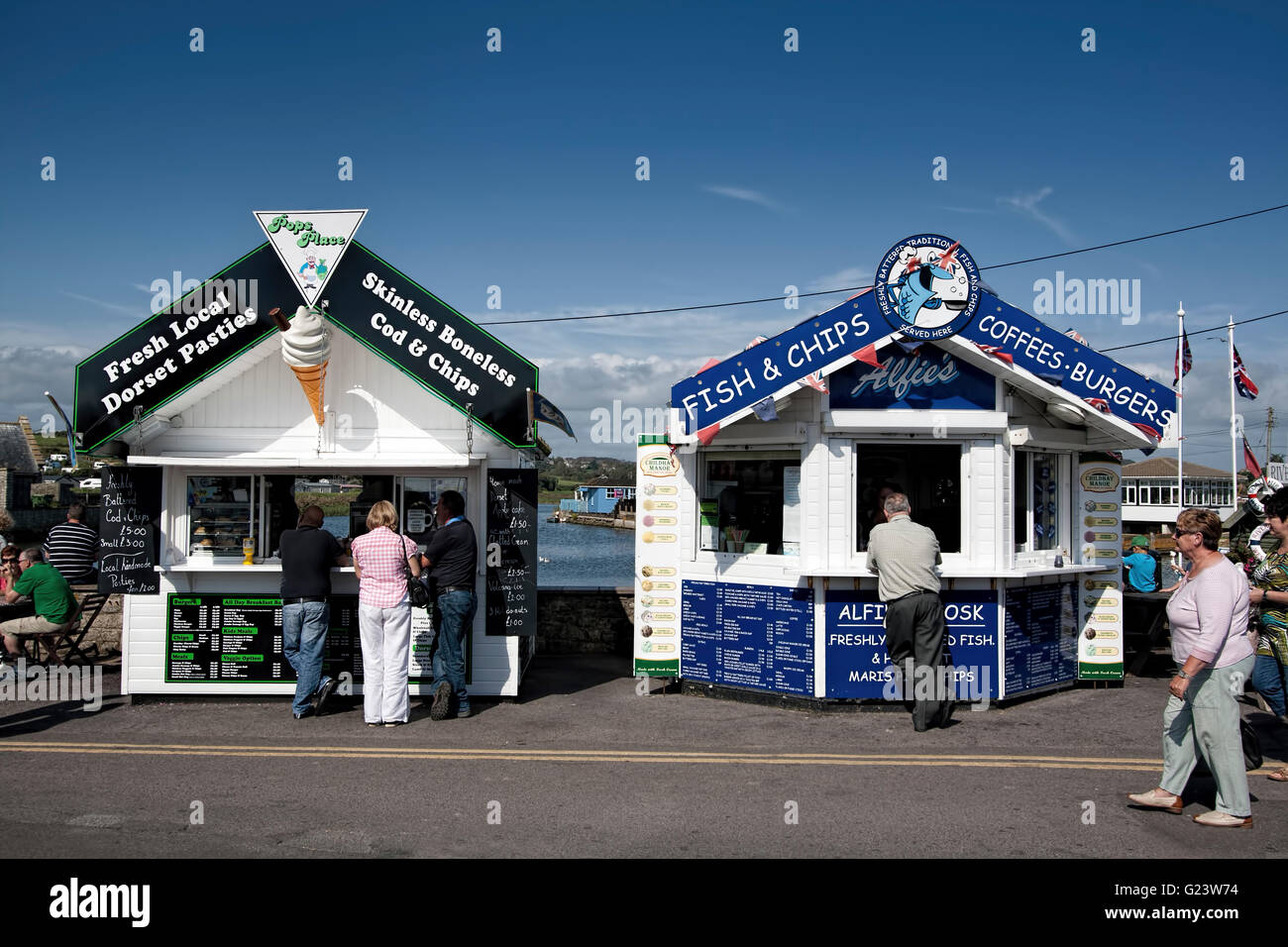 Food kiosks on the quay at West Bay Harbour, Dorset England UK Europe Stock Photo