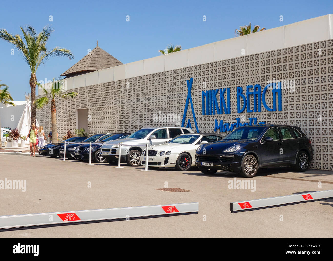 Luxury cars parked at Nikki Beach Marbella, Andalusia, Spain. Stock Photo