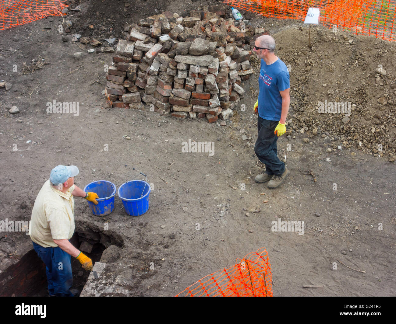 Men working on an archaeological dig in the walled garden at Auckland Castle Durham England UK Stock Photo