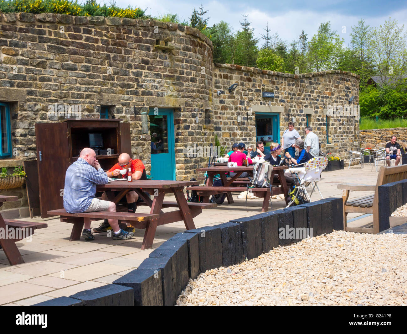 Family groups enjoying sunshine at the popular Lord Stones