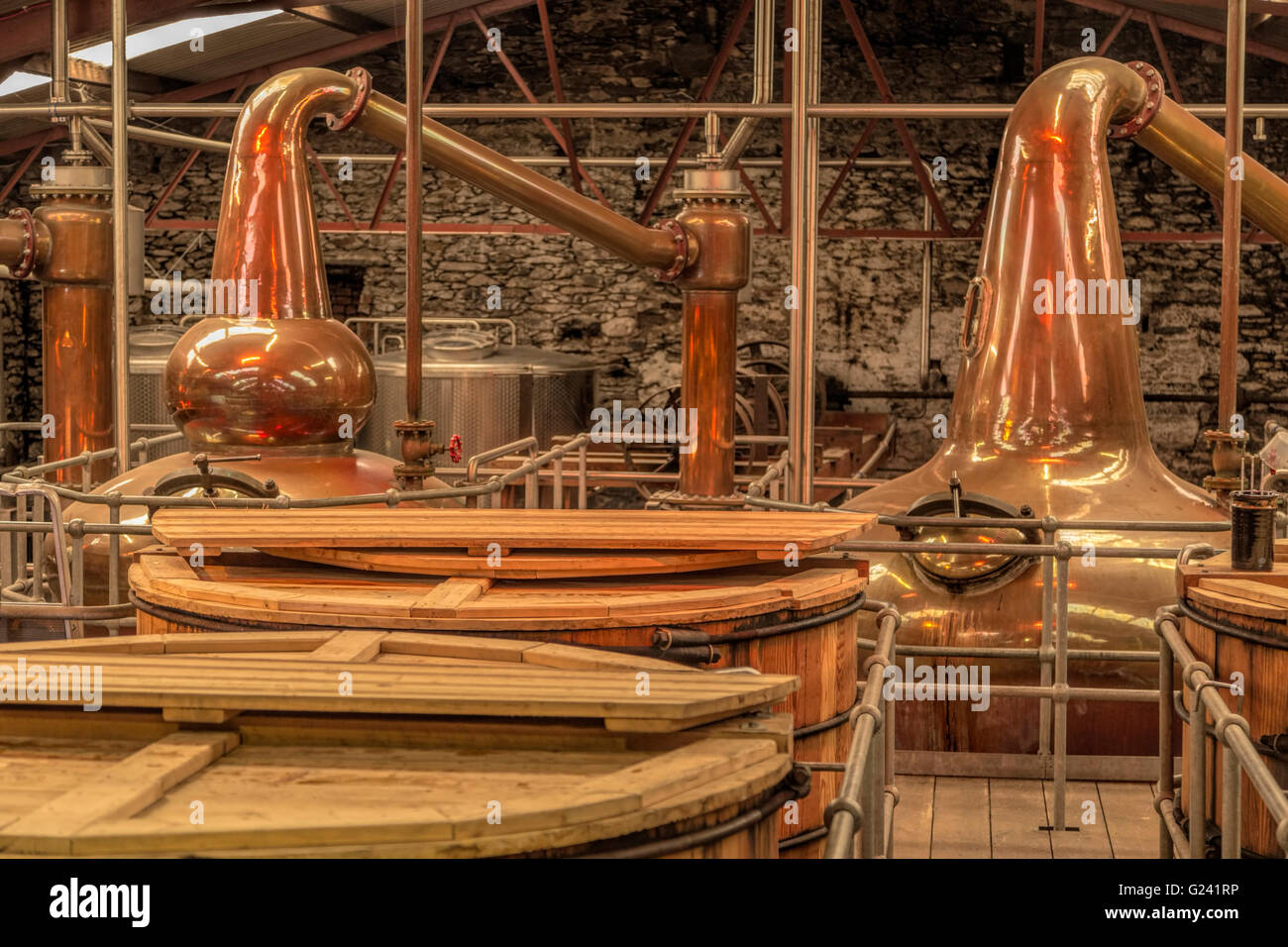 Pot stills, copper-to-golden distillation cauldrons in the Dingle Whiskey Distillery, in Dingle, County Kerry, Ireland. Stock Photo