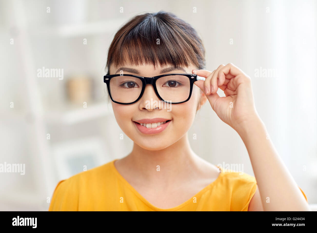 happy asian young woman in glasses at home Stock Photo - Alamy