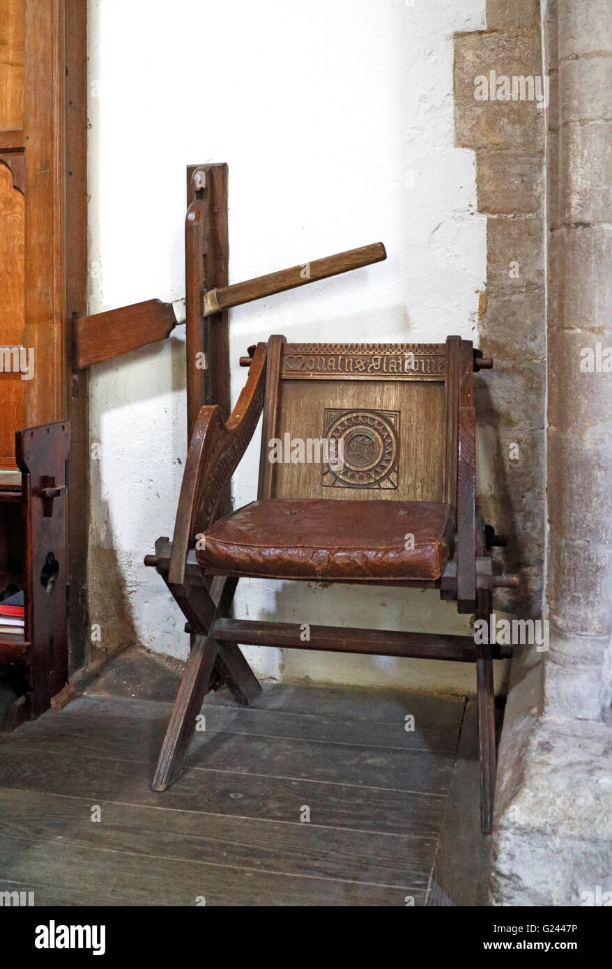 Manually operated organ bellows and chair in the parish church of St Lawrence at Castle Rising, Norfolk, England, UK. Stock Photo