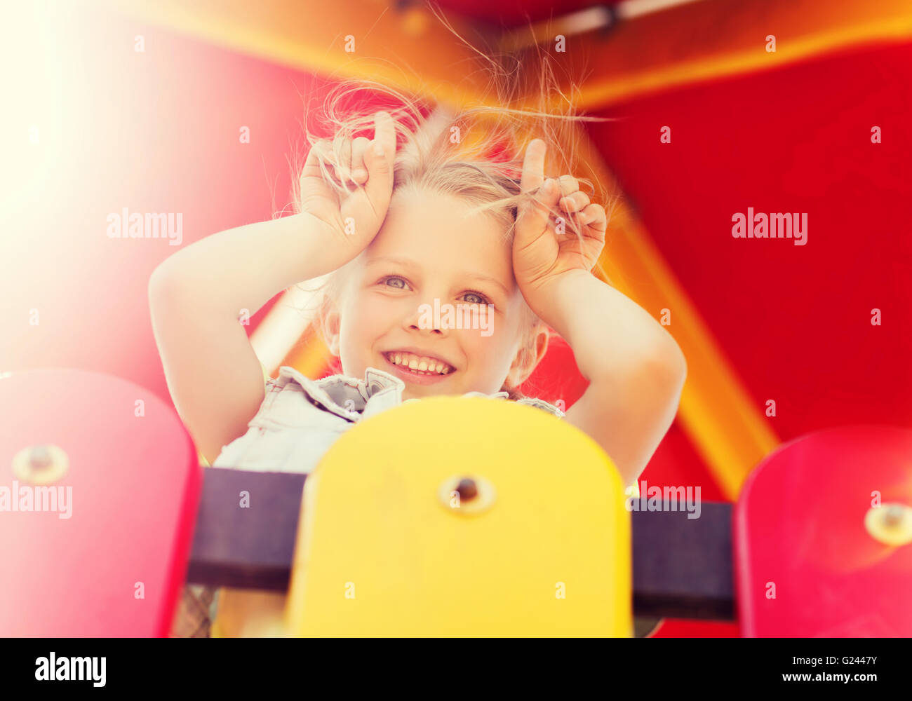 happy little girl on children playground Stock Photo - Alamy