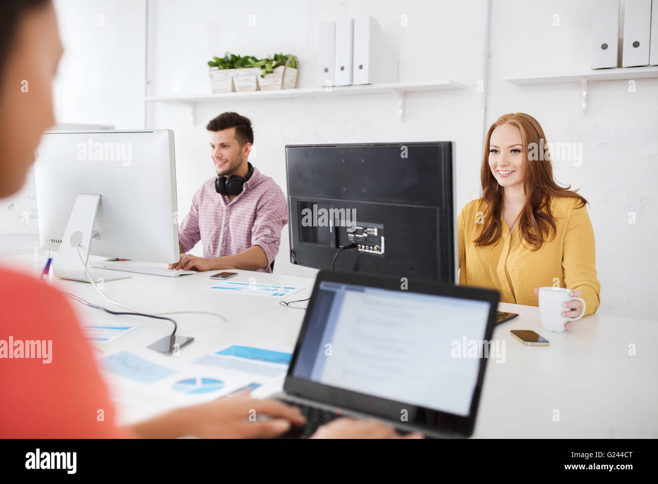creative team with computers working at office Stock Photo - Alamy