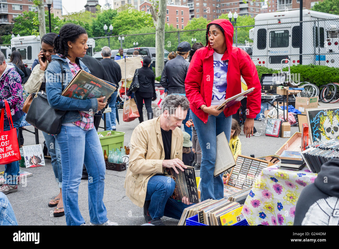 Shoppers search for bargains at the humongous Penn South Flea Market in the New York neighborhood of Chelsea on Saturday, May 21, 2016. The flea market appears like Brigadoon, only once every year, and the residents of the 20 building Penn South cooperatives have a closet cleaning extravaganza. Shoppers from around the city come to the flea market which attracts thousands passing through.  (© Richard B. Levine) Stock Photo