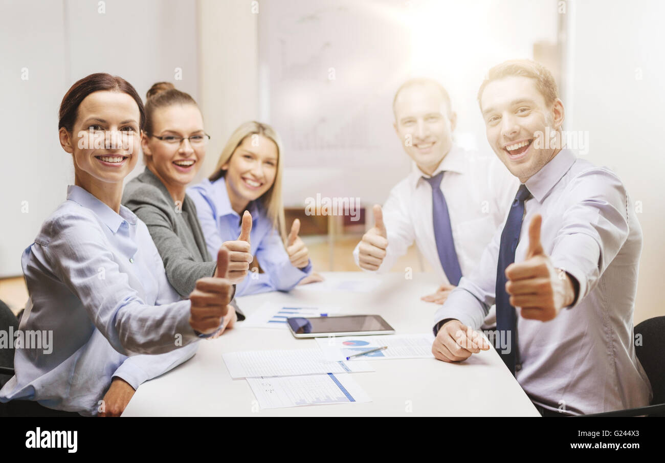 business team showing thumbs up in office Stock Photo - Alamy