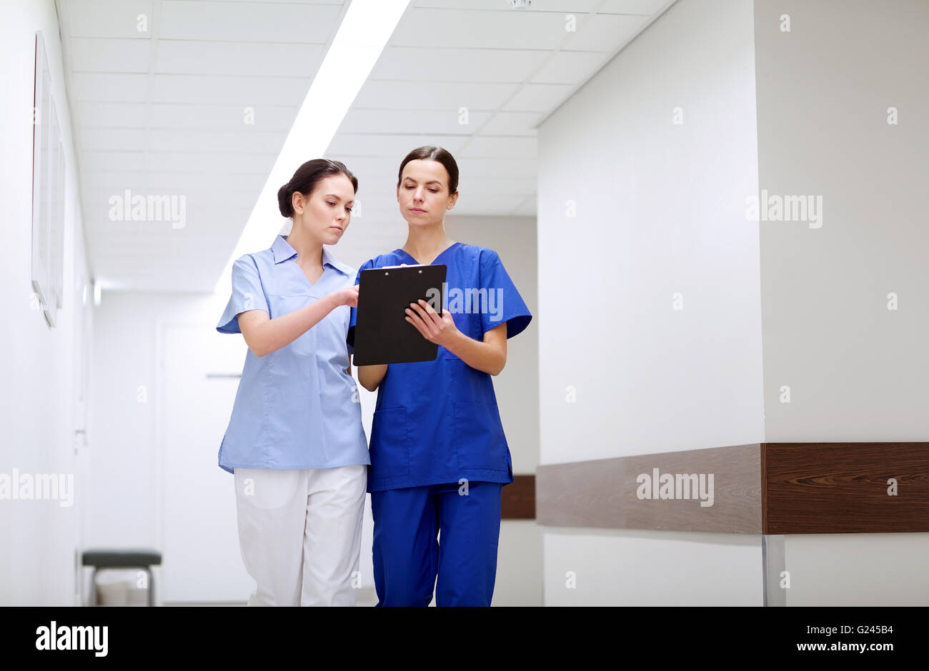 Two nurses with notes hi-res stock photography and images - Alamy