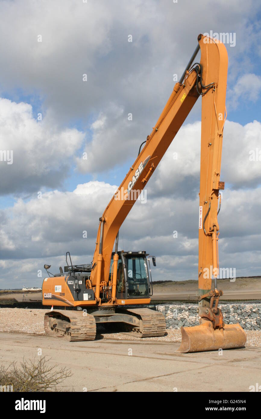 A SUNNY PORTRAIT SIZE PHOTO OF A YELLOW CASE ENVIRONMENT AGENCY DIGGER Stock Photo