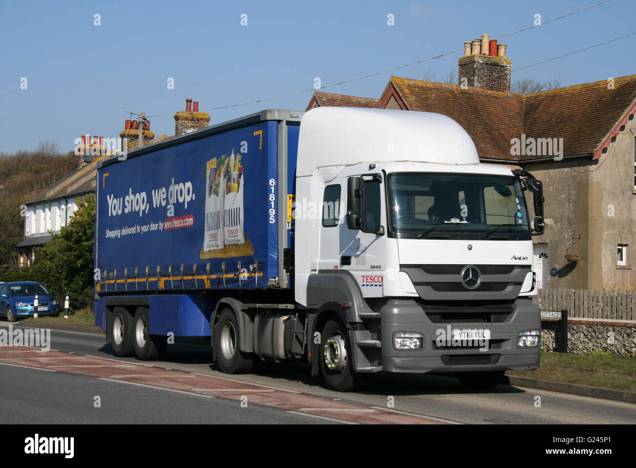 A TESCO MERCEDES-BENZ DELIVERY TRUCK ON AN A ROAD Stock Photo