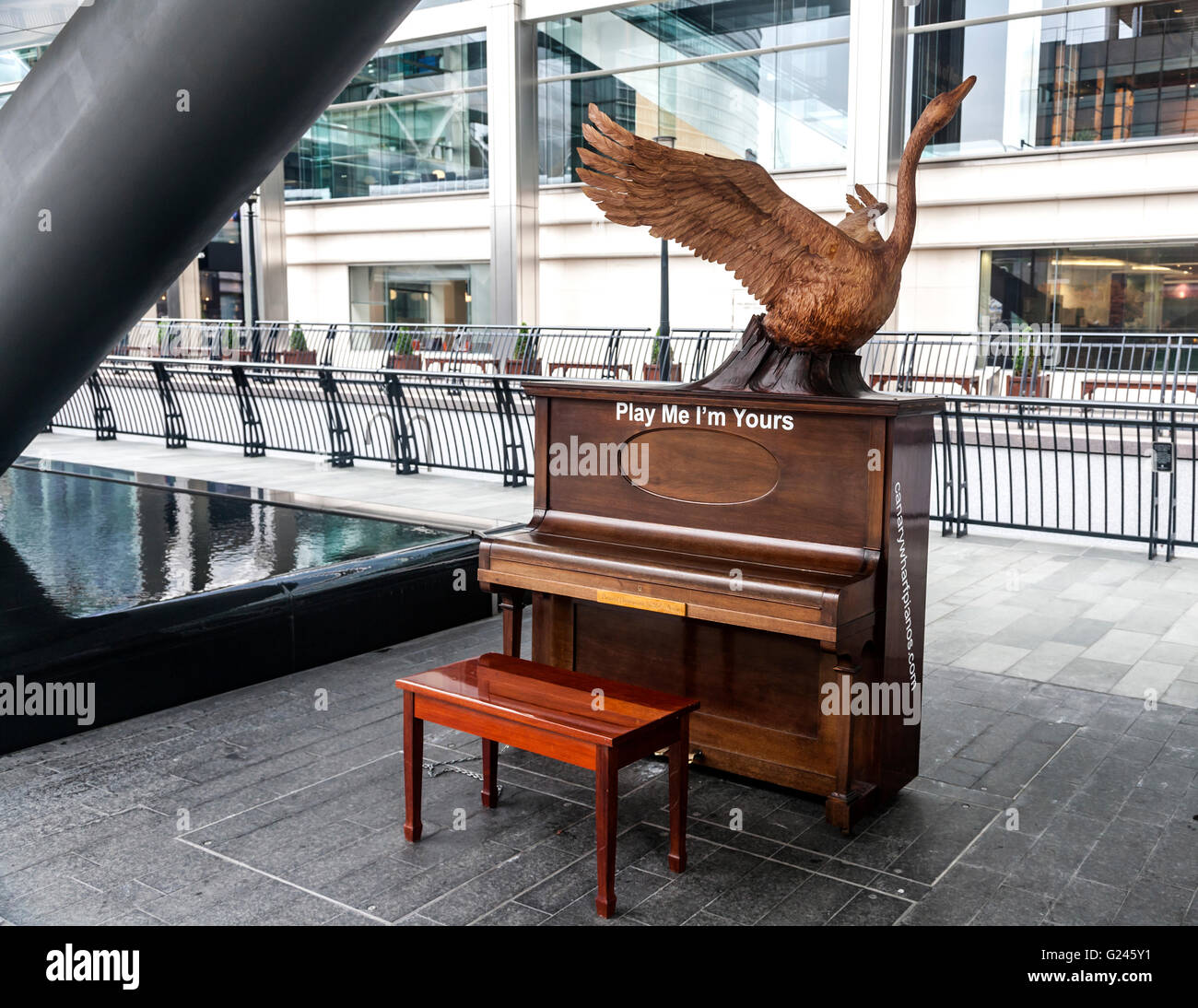 One of many pianos in Play Me I’m Yours, a Global artwork by British artist Luke Jerram, Canary Wharf, London. Stock Photo