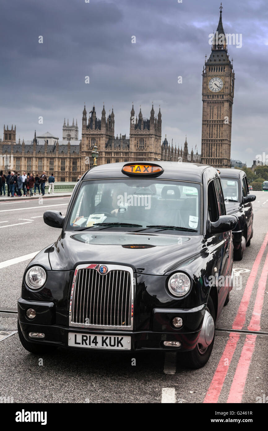 Black Taxi Cab on Westminster Bridge, London, England. Stock Photo