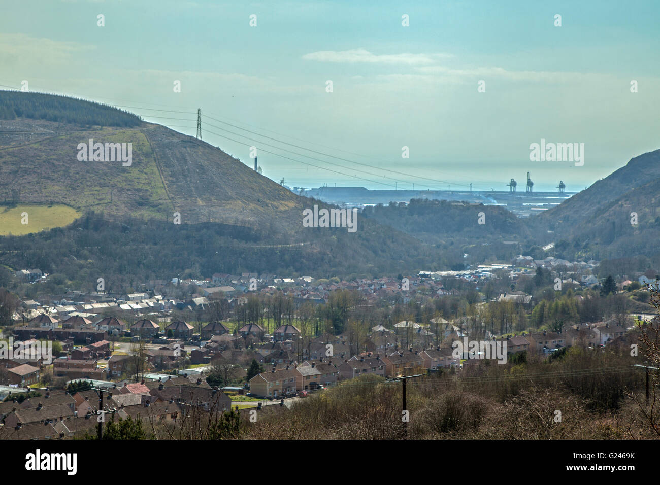Port Talbot steel works is pictured beyond the town of Cwmafan. Stock Photo