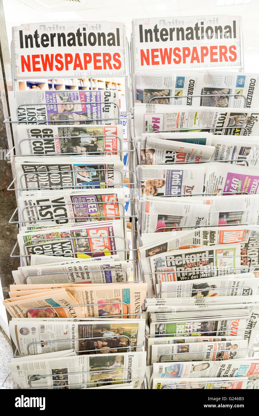 International newspapers, mostly British sold abroad, on sale in airport, Malta Stock Photo