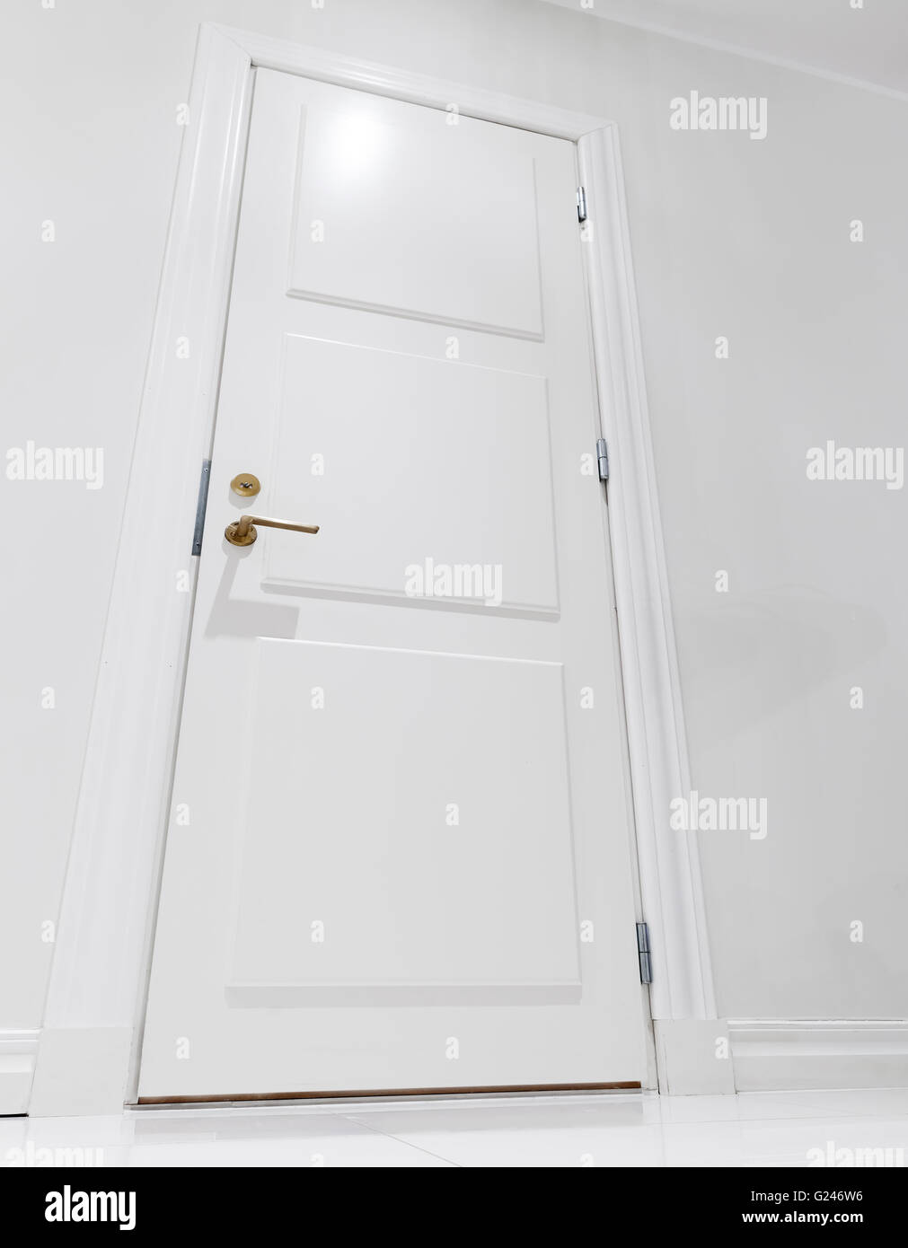 Closed white domestic door. Empty interior fragment Stock Photo