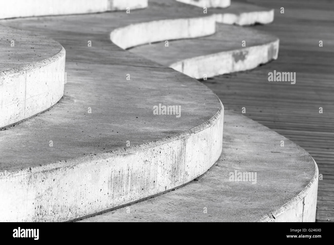 Abstract concrete interior fragment, white curved stairs. Photo with selective focus Stock Photo