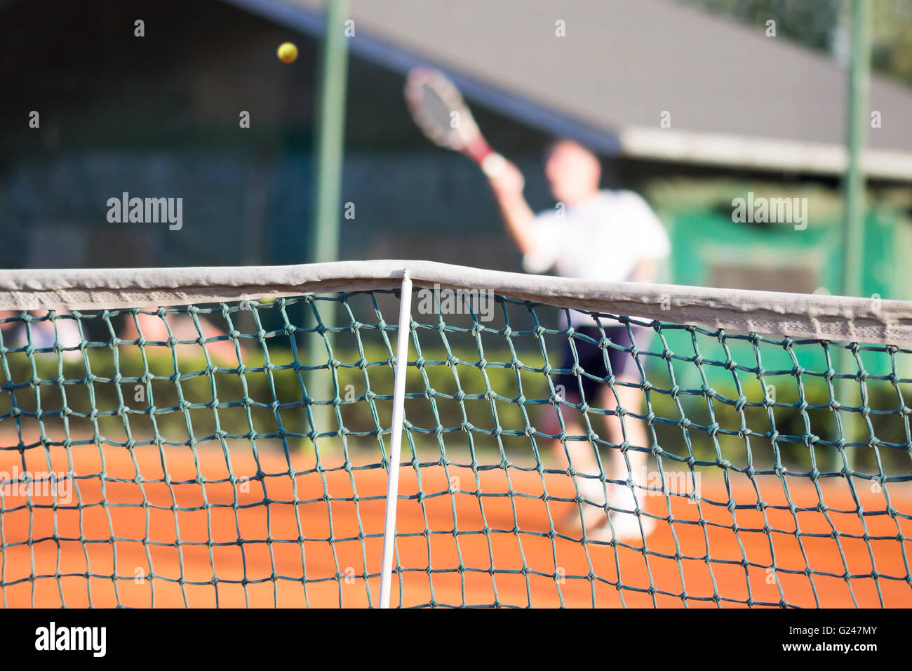 Tennis net, Man plays tennis, blurred motion Stock Photo Alamy