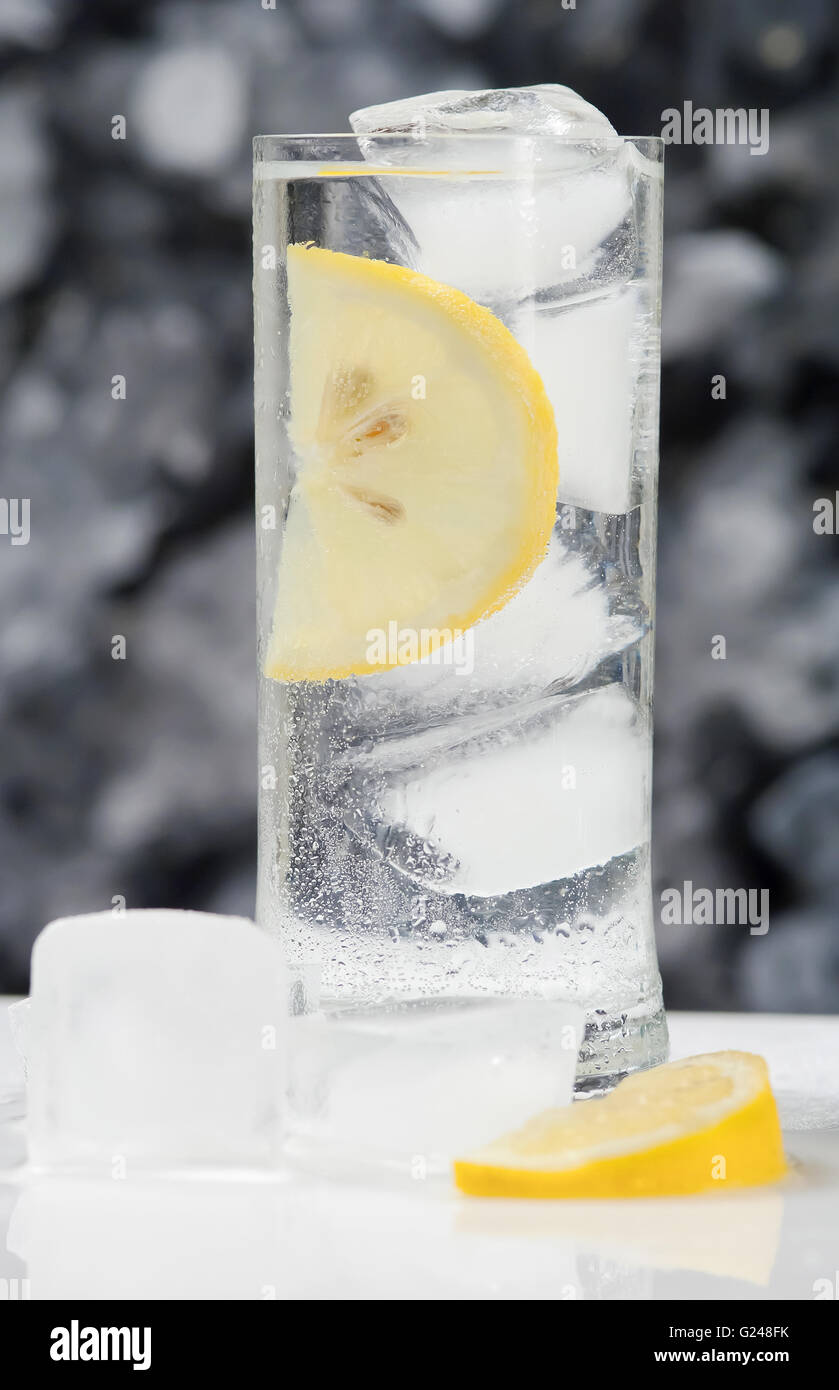Glass with fresh water and ice cubes Stock Photo - Alamy