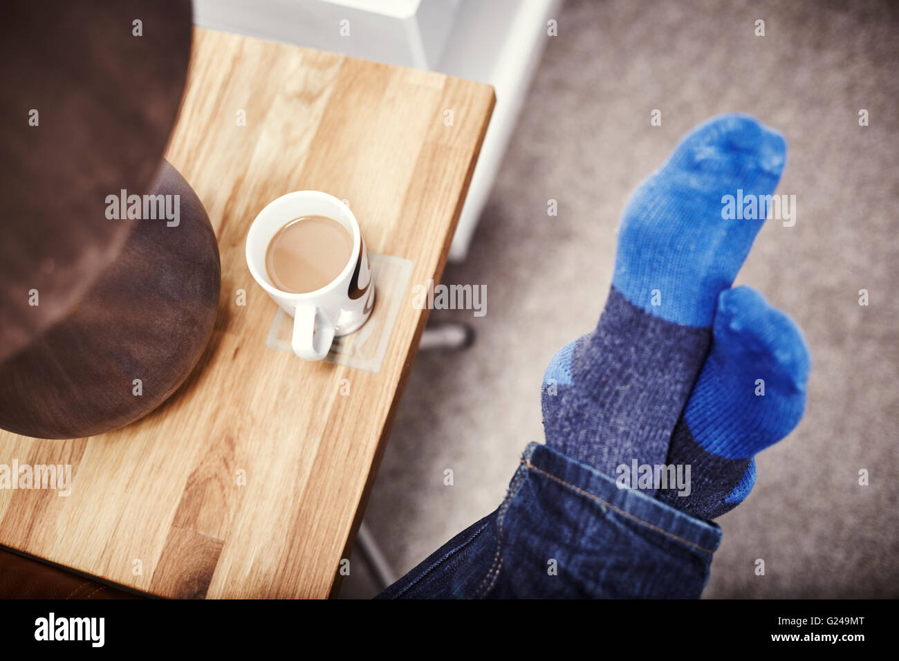 Feet on couch hi-res stock photography and images - Alamy