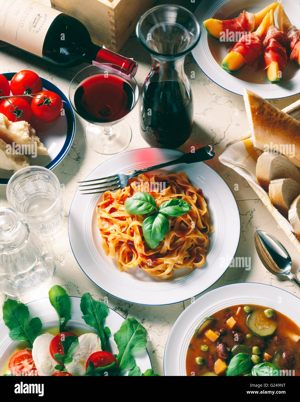 Italian national cuisine, Tagliatelle with tomato sauce, Parmesan cheese, mozzarella cheese, minestrone soup Stock Photo
