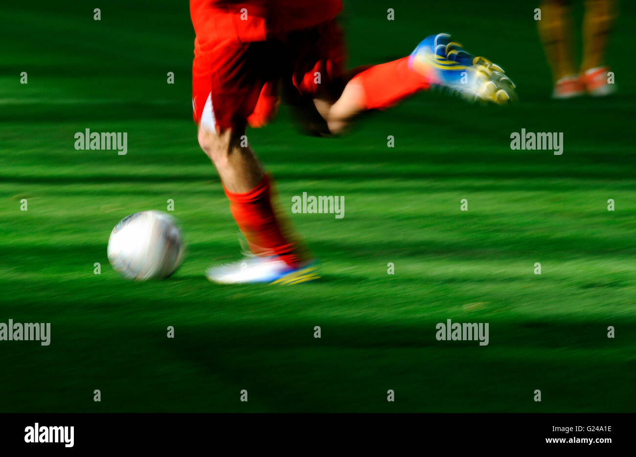 Free Stock Photo of Two footballers are fighting for the ball on the  football field