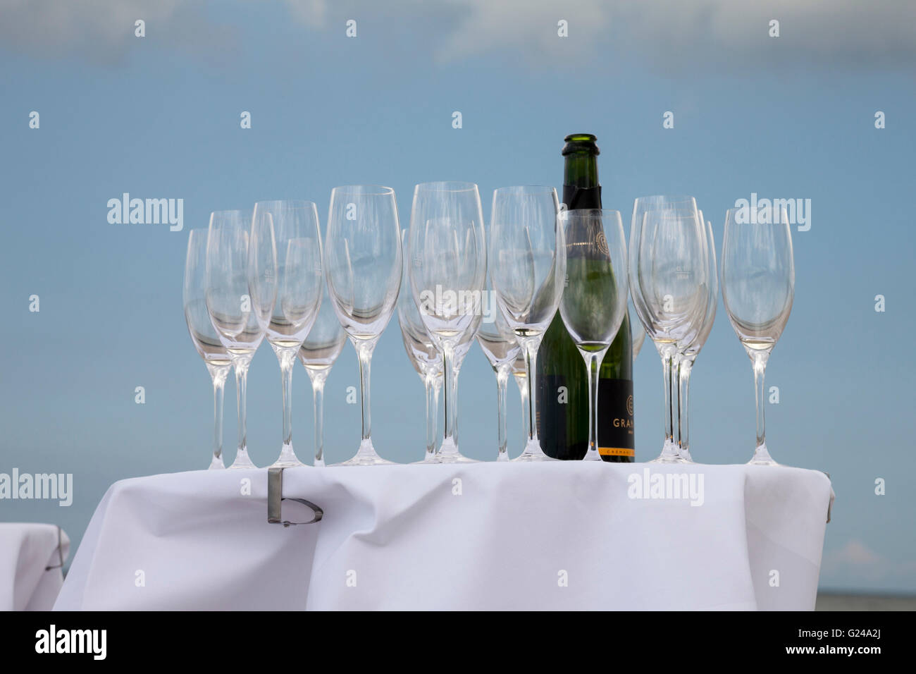 Bar table with champagne glasses and a bottle of champagne, Germany Stock Photo