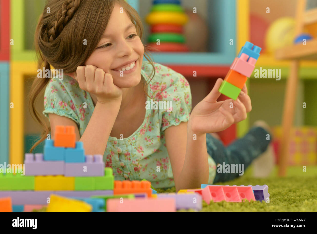 little girl playing with toys Stock Photo - Alamy