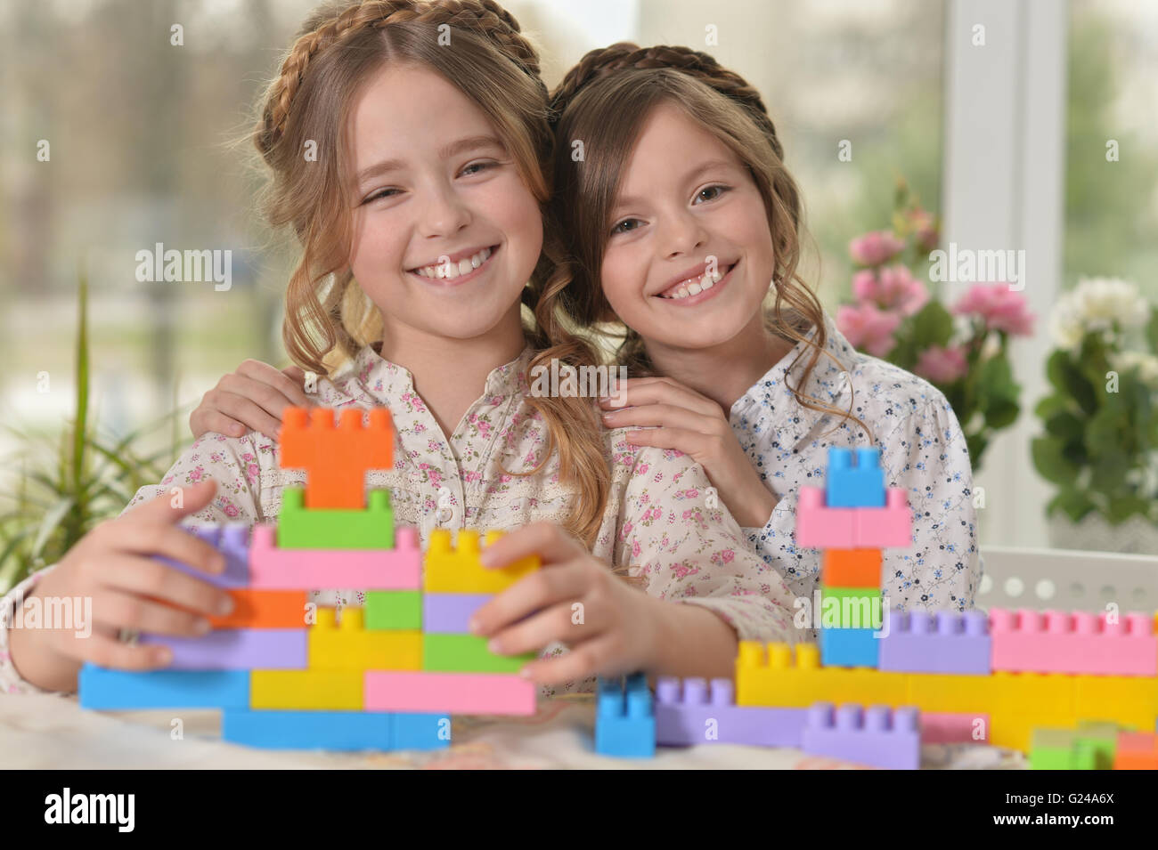 little girls playing toys Stock Photo - Alamy