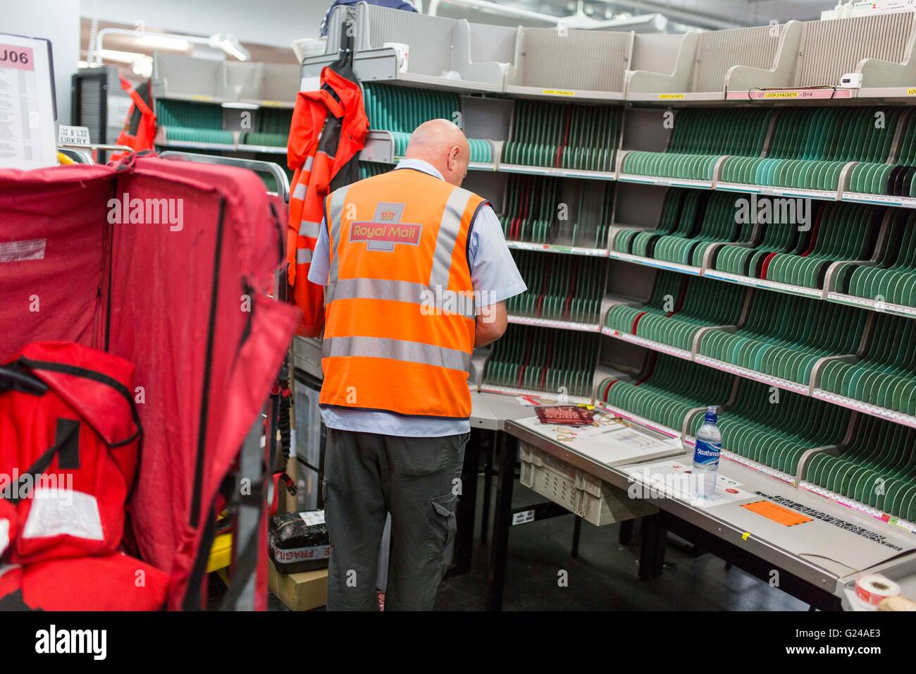 Royal Mail Sorting Office. A man works. Stock Photo