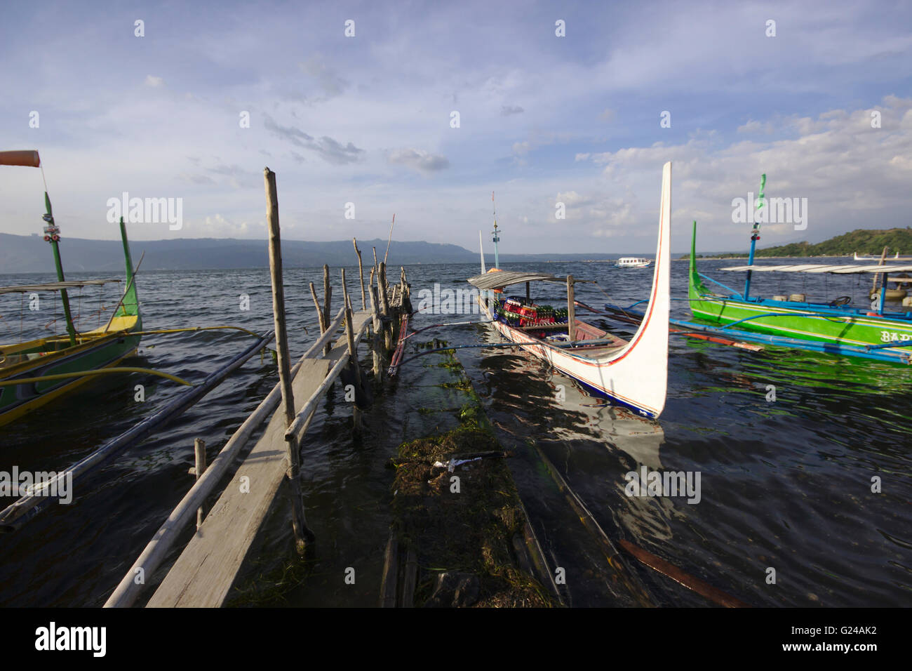 Outrigger boats on the shore of volcano island, Lake Taal, Philippines Stock Photo
