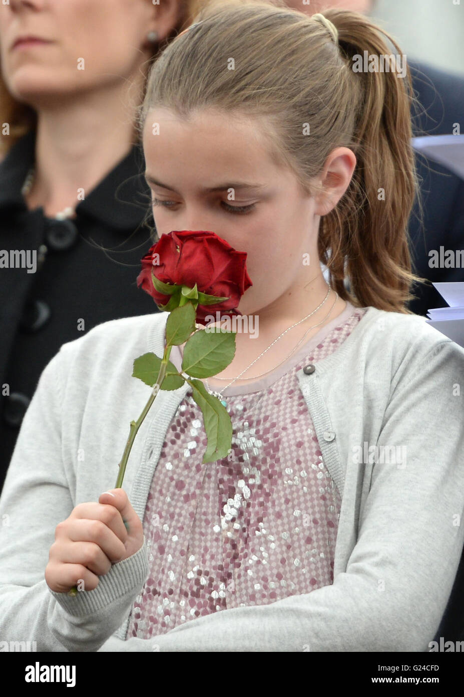 Agatha Heber-Percy, 11, great great grandchild of Admiral Sir John Jellicoe, holds a rose during a wreath laying ceremony to commemorate the Battle of Jutland in Trafalgar Square, London. Stock Photo