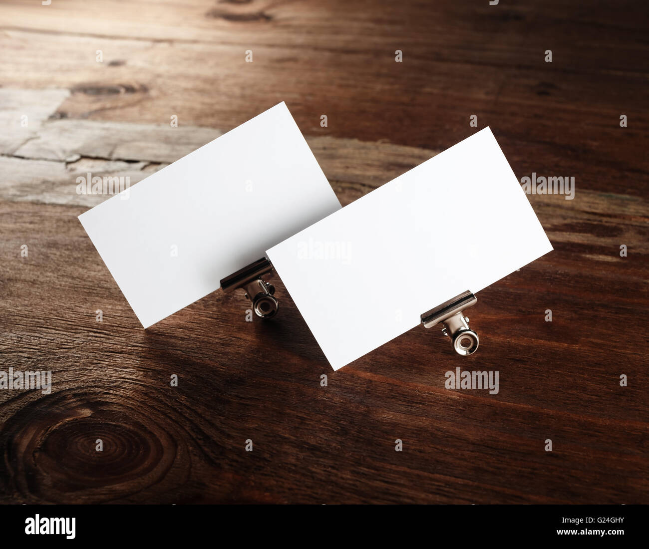 Photo of blank white business cards on wooden table background. Blank ID template. Template for branding identity. Stock Photo